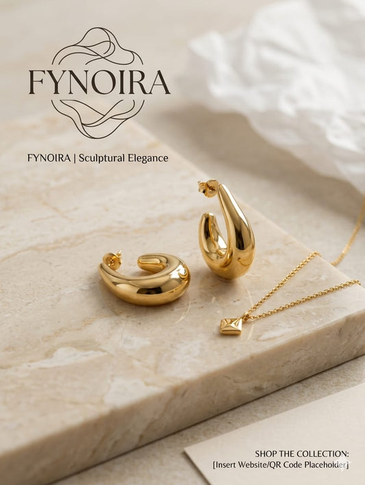 sculptural gold teardrop hoop earrings